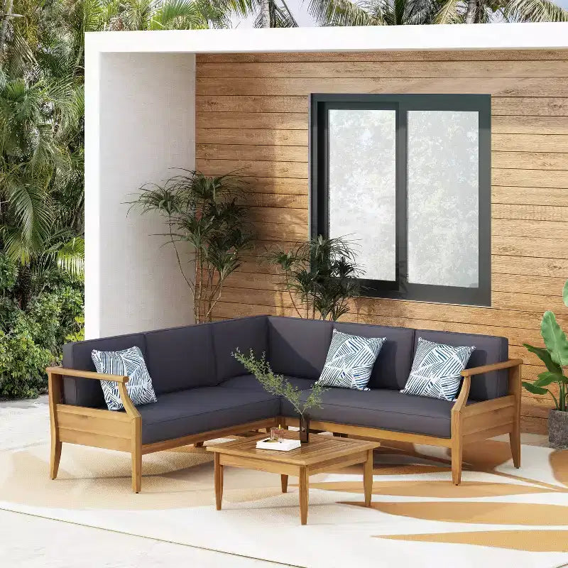 4 részes Aston kültéri, századközepi modern stílusú akácfa sarokülőgarnitúra párnákkal, teakfa/sötétszürke – Christopher Knight Home