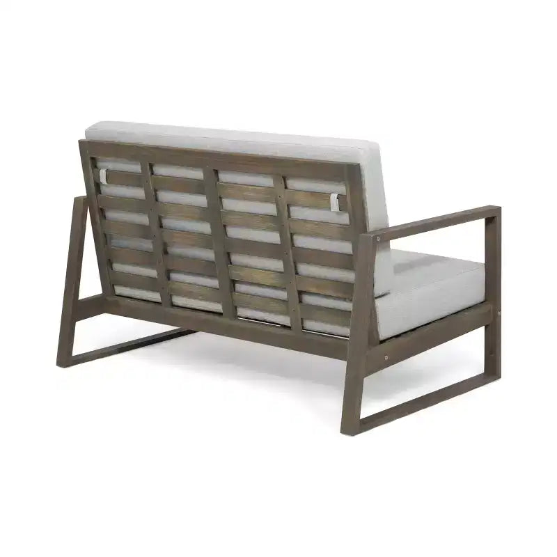Conjunto Christopher Knight Home Hazel de sofá biplaza y mesa de centro de madera de acacia para exteriores, con cojines