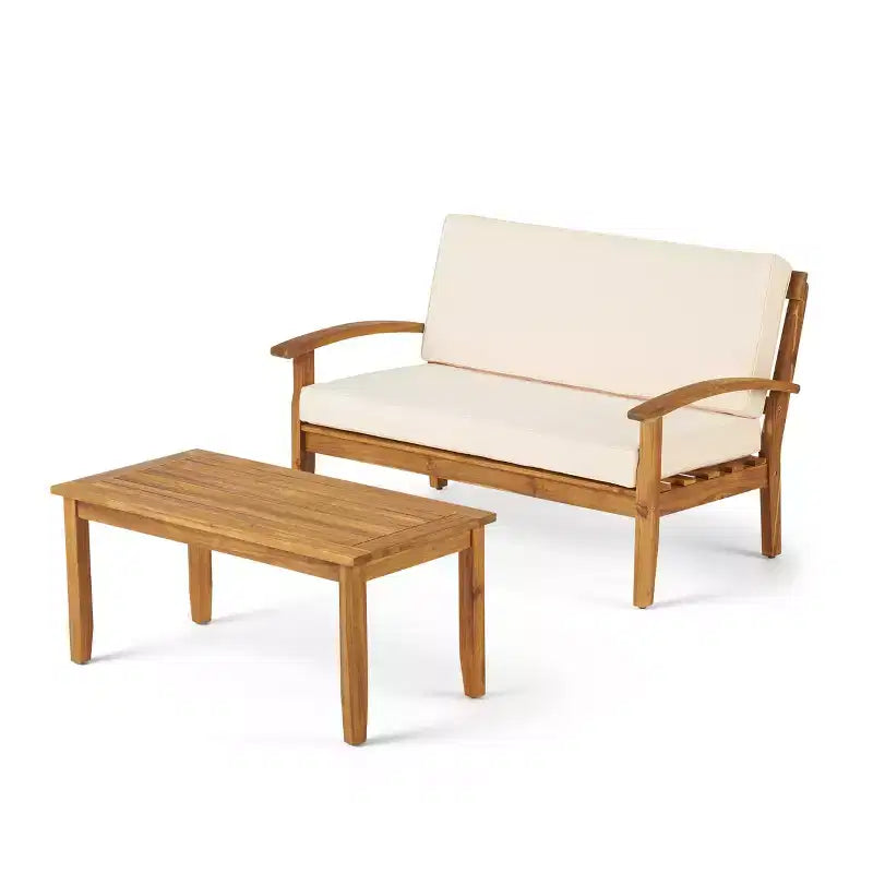 Conjunto GDFStudio Keanu de sofá biplaza y mesa de centro de madera de acacia para exteriores, con cojines