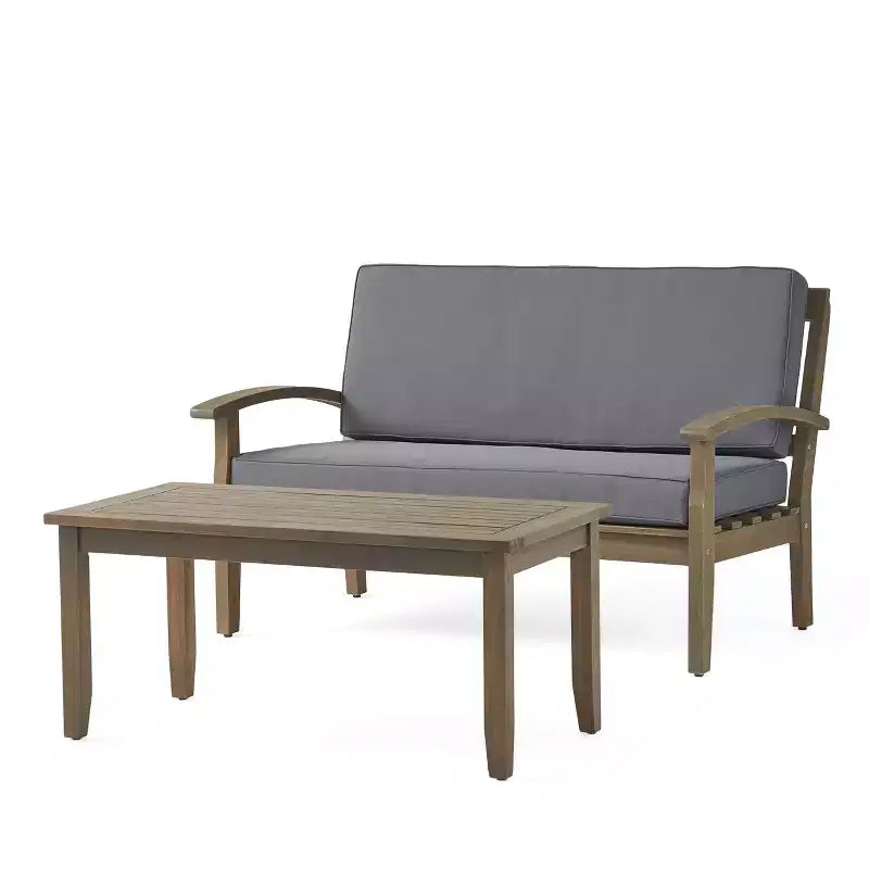 Conjunto GDFStudio Keanu de sofá biplaza y mesa de centro de madera de acacia para exteriores, con cojines