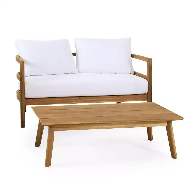 Conjunto GDFStudio Aggie de sofá biplaza y mesa de centro de madera de acacia para exteriores, con cojines, teca/blanco