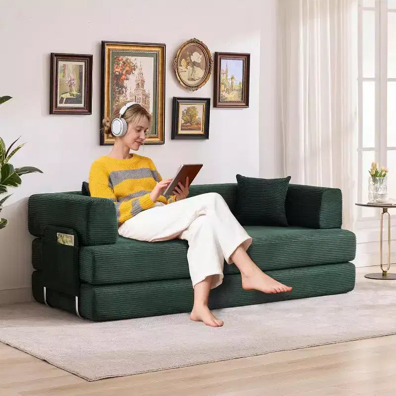 Corduroy floor sofa bed with pillows, convertible armrests and backrest, suitable for living rooms, bedrooms, and apartments.