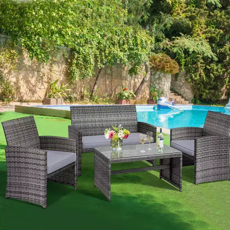 Set di mobili da patio Costway da 4 pezzi in rattan, per conversazione, con piano del tavolo in vetro e imbottitura, Turchese/Rosso/Grigio/Beige/Blu navy/Nero