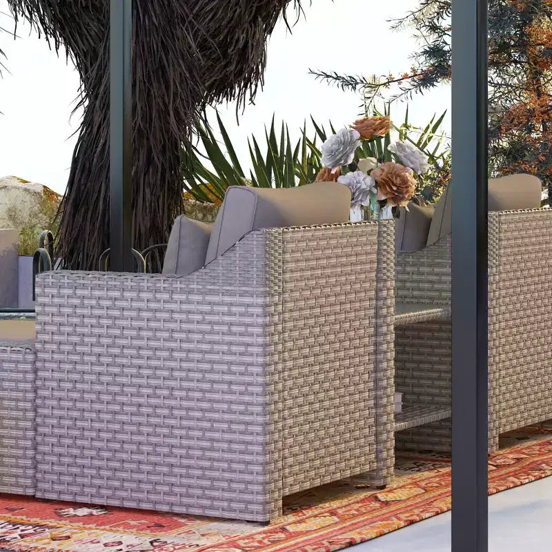 Ensemble de mobilier de terrasse Outsunny de 5 pièces, ensemble de fauteuils de conversation et pouf en rotin PE toutes saisons, avec table, coussins et oreillers inclus