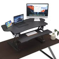 Mount-It! Height Adjustable Standing Desk Converter | 48 Wide Tabletop Sit Stand Desk Riser with Gas Spring | Stand Up Workstation Fits Dual Monitors